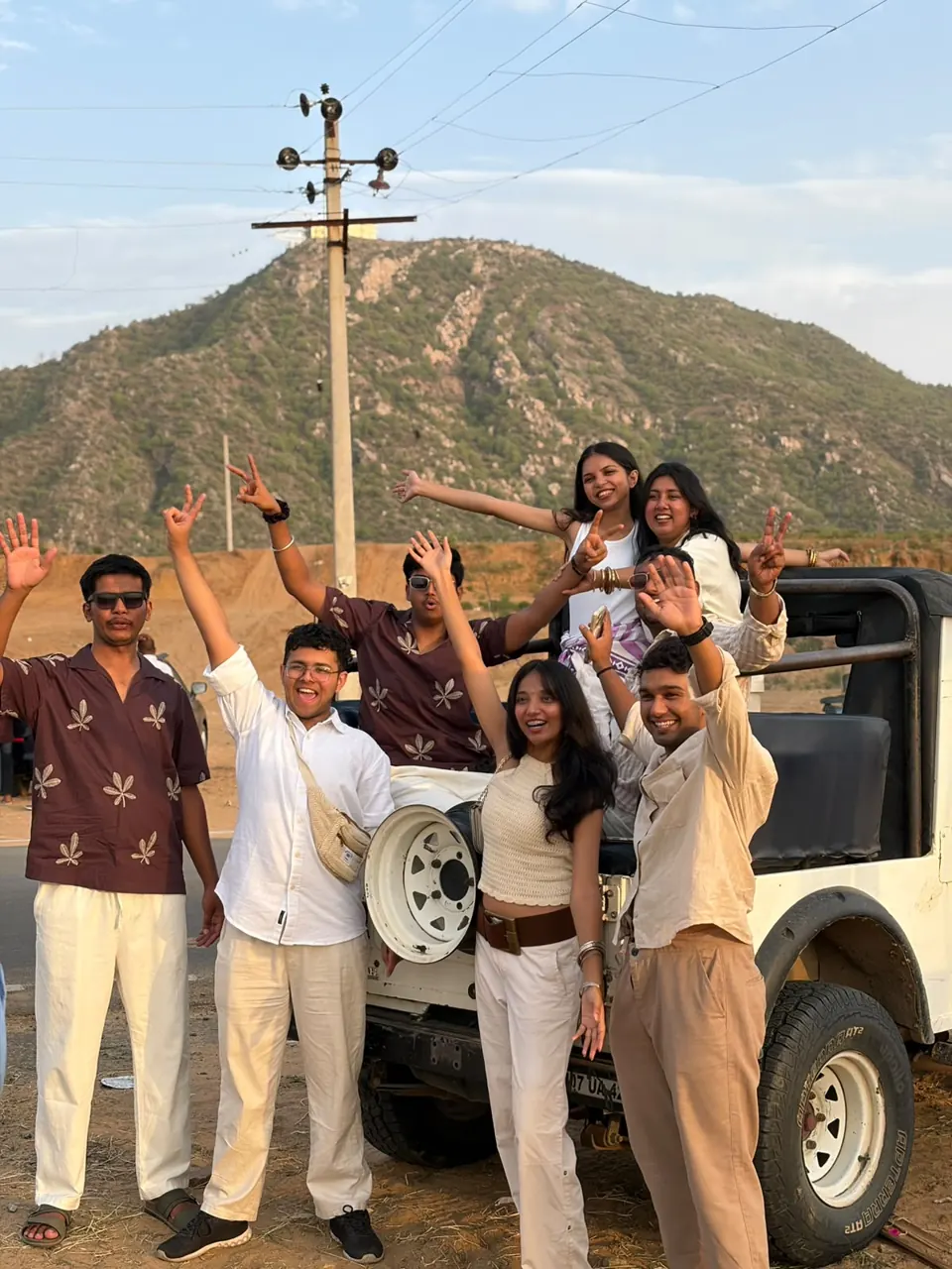 A group of guests celebrating their jeep safari experience
